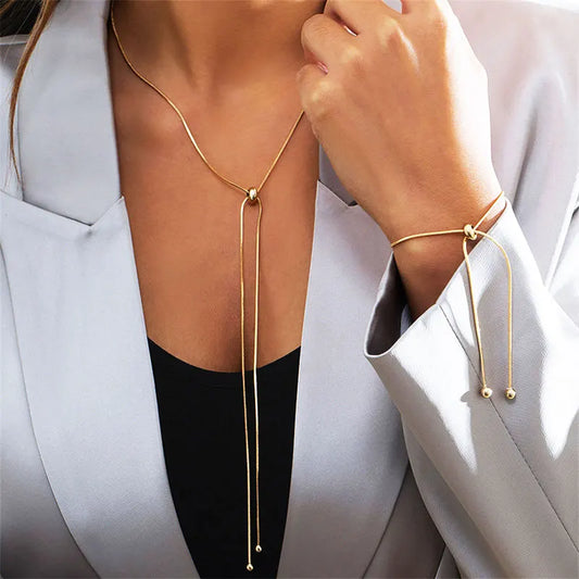 Gold Tone Knot Long Tassel Plunge Necklace